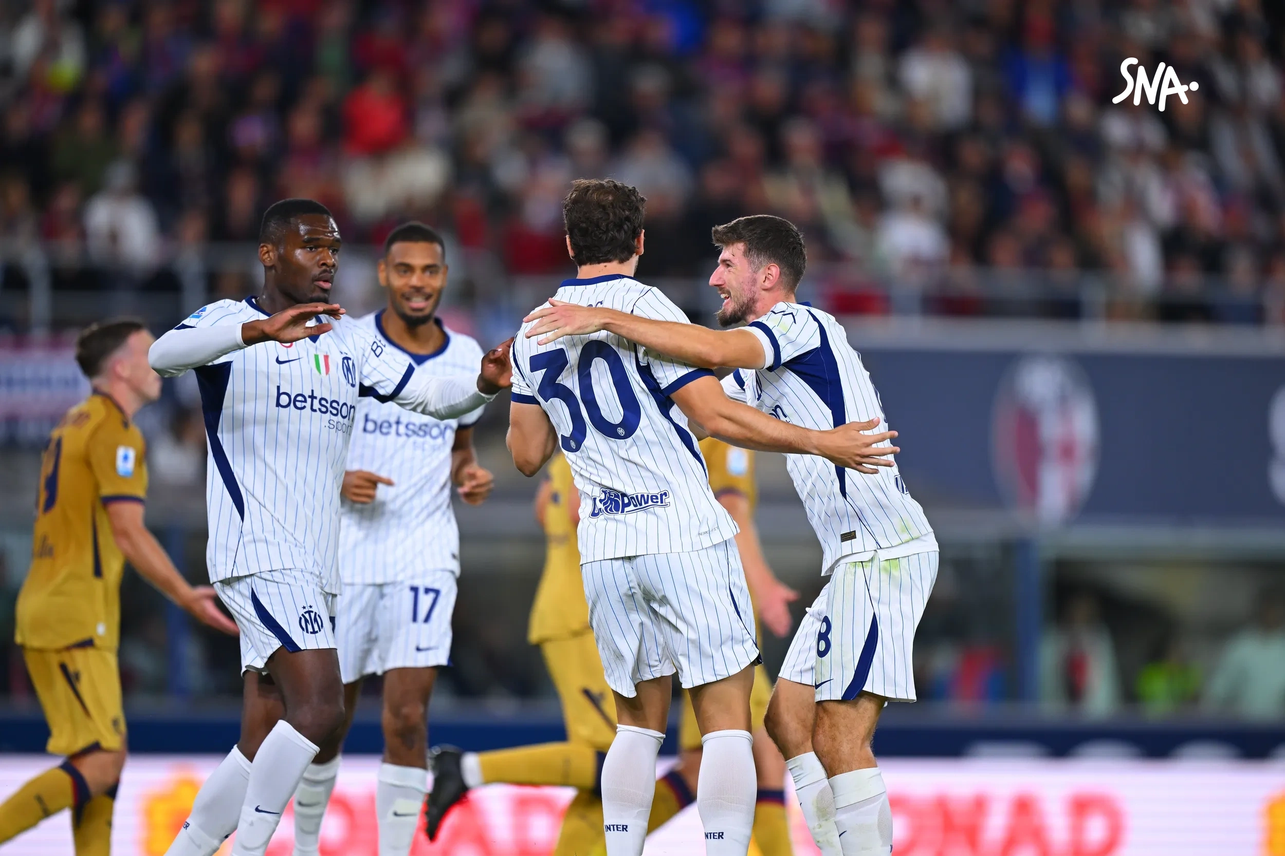 Carlos Augusto celebrates with his teammates at Bologna on October 17, 2026.
