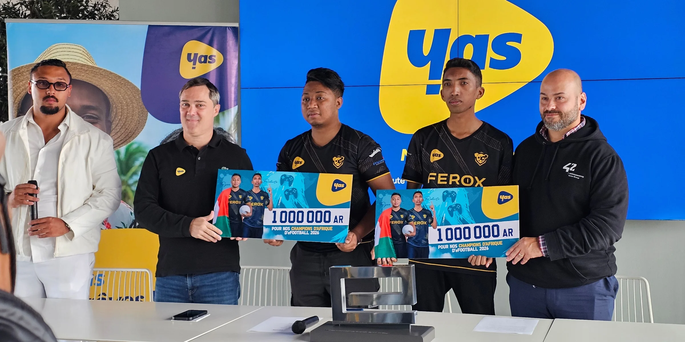 Roberto SK and JZ Rayan receiving awards in Andraharo on September 3, 2026, after qualifying for the FIFAe Finals.