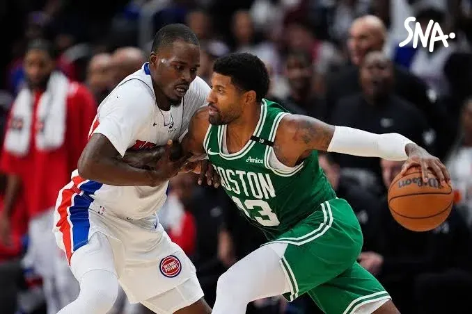 Paul George drives with the ball against Javonte Green's defence in the Boston and Detroit game on 20 October 2026.