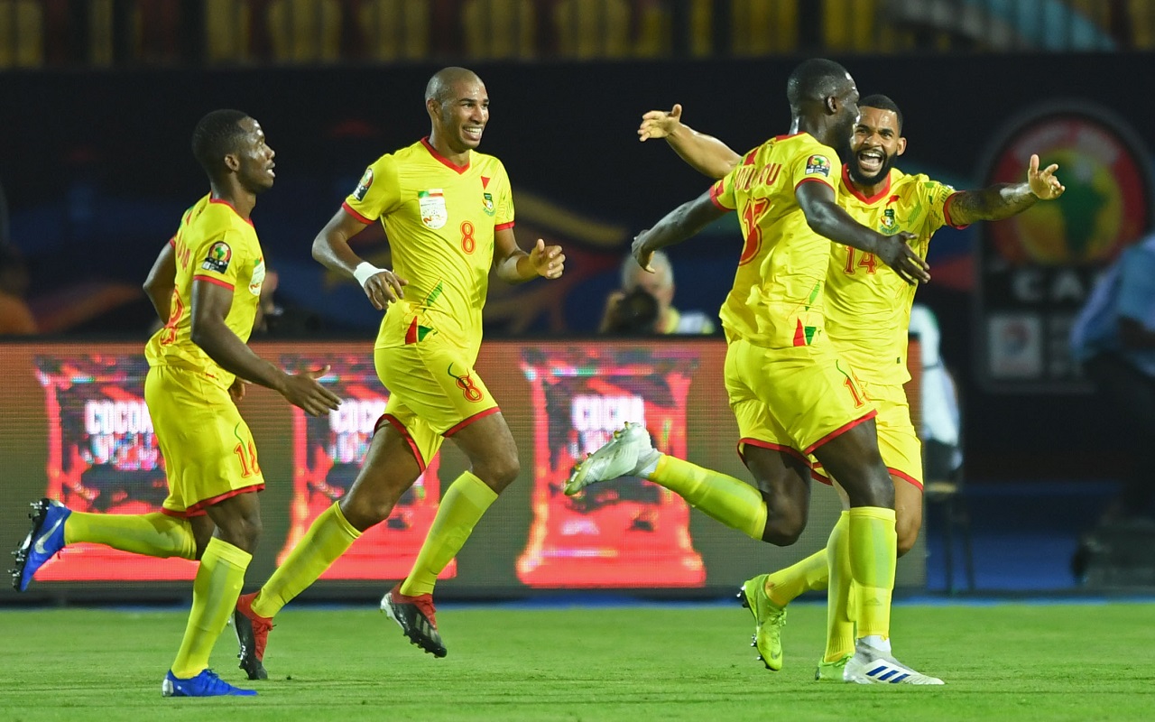 Benin's defender Moise Adilehou (2nd-R) celebrates with his teammates after scoring a goal during the 2019 Africa Cup of Nations (CAN) Round of 16 football match between Morocco and Benin at the Al-Salam Stadium in the Egyptian capital Cairo on July 5, 2019. (Photo by OZAN KOSE / AFP)