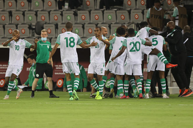 Comoros players celebrate their first goal during the 2021 FIFA Arab Cup qualifier match between Palestine and Comoros at Jassim bin Hamad Stadium in Doha, on June 24, 2021. (Photo by KARIM JAAFAR / AFP)