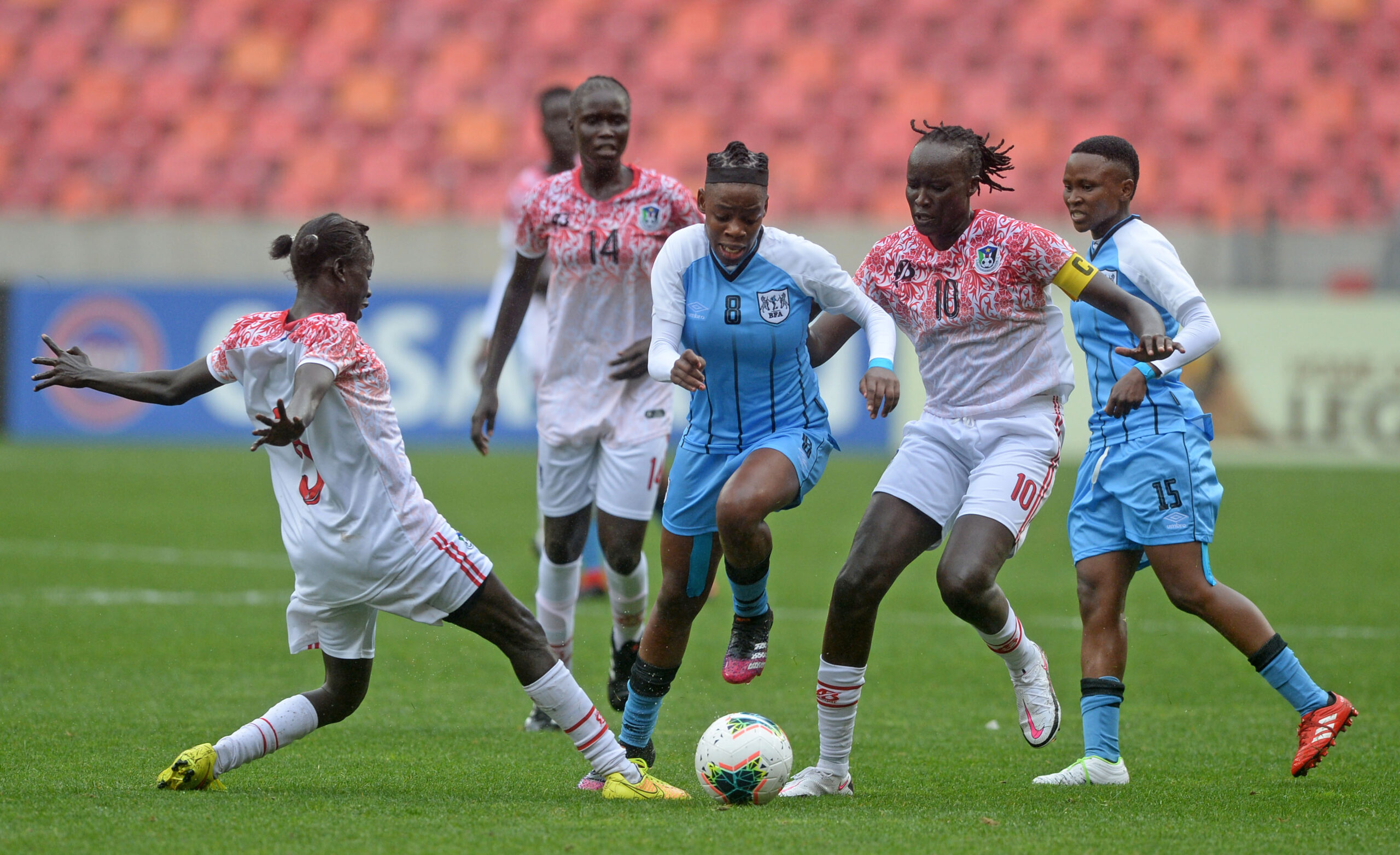 Lone Gaofetoge of Botswana is challenged by Dorka Lokeri Lam and Amy Lasu of South Sudan during the 2021 COSAFA Womens Championship Group B game between Botswana and South Sudan at Nelson Mandela Bay Stadium in Gqeberha on 29 September 2021 ©Ryan Wilkisky/BackpagePix