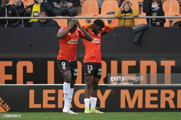 Lorient's Nigerian forward Terem Moffi (R) and Malian forward Ibrahima Kone react during the French L1 football match between Lorient and Montpellier at the Moustoir Stadium in Lorient, western France, on February 20, 2022. (Photo by LOIC VENANCE / AFP) (Photo by LOIC VENANCE/AFP via Getty Images)