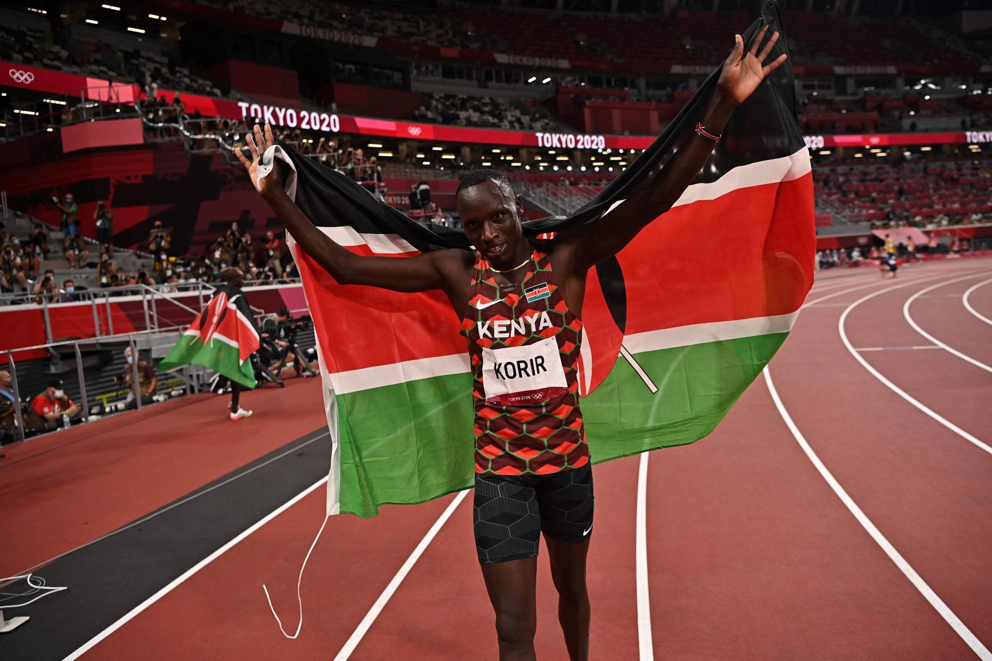 Kenya's Emmanuel Kipkurui Korir celebrates after winning the men's 800m final during the Tokyo 2020 Olympic Games at the Olympic Stadium in Tokyo on August 4, 2021. (Photo by Ben STANSALL / POOL / AFP)
