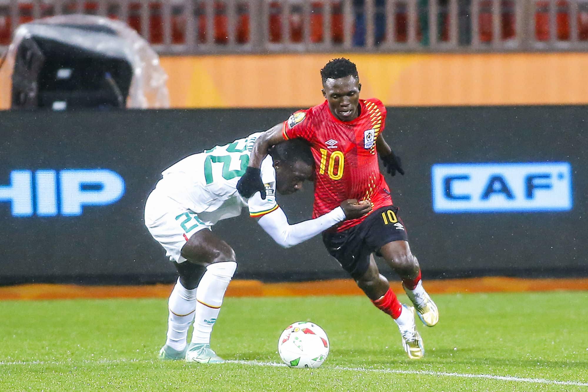 Cheikhou Omar Ndiaye of Senegal and Travis Mutyaba of Uganda challenge for possession during the 2022 CAF African Nations Championship match between Senegal and Uganda at 19 Mai 1956 Stadium in Annaba, Algeria on 18 January 2023 ©Sports Inc - Photo by Icon sport