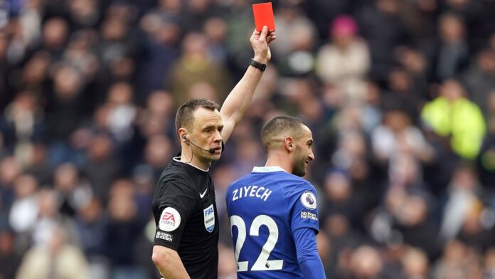 Referee Stuart Attwell shows a red card to Chelsea?s Hakim Ziyech before overturning it after checking the pitchside VAR monitor during the Premier League match at the Tottenham Hotspur Stadium, London. Picture date: Sunday February 26, 2023. - Photo by Icon sport