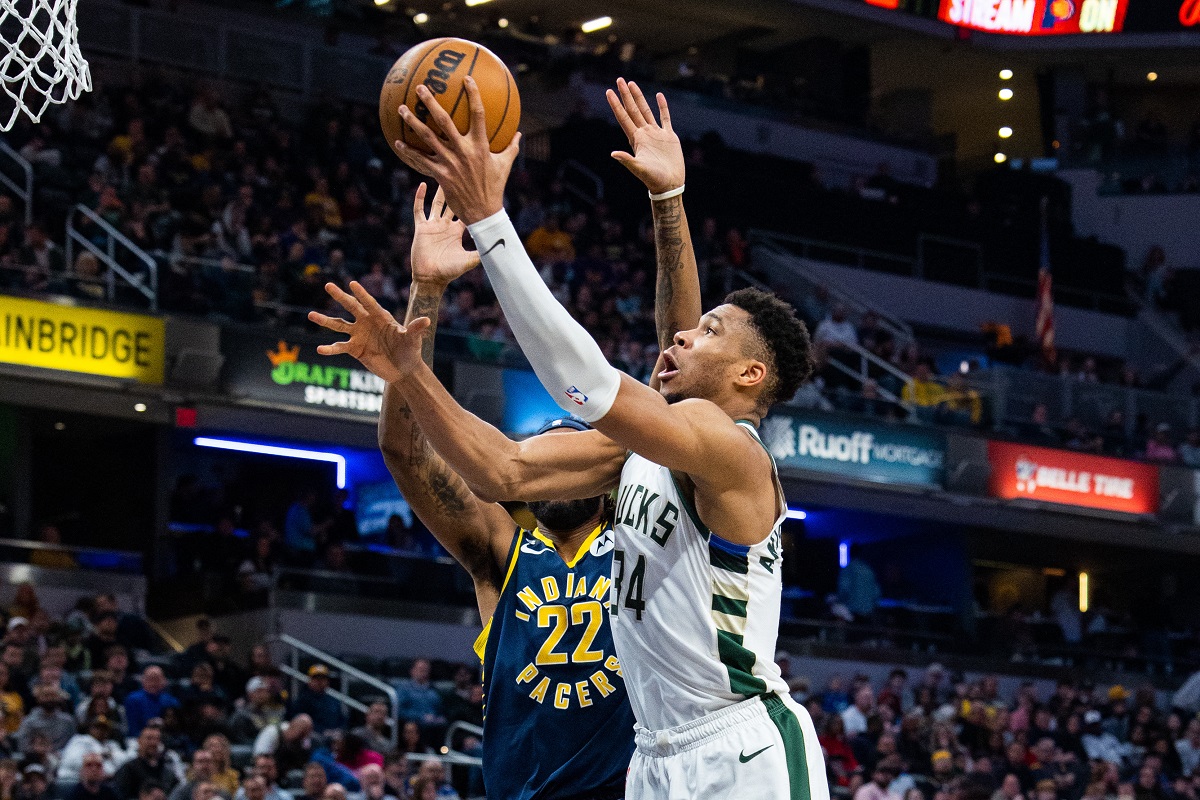 Mar 29, 2023; Indianapolis, Indiana, USA; Milwaukee Bucks forward Giannis Antetokounmpo (34) shoots the ball while Indiana Pacers forward Isaiah Jackson (22) defends in the second quarter at Gainbridge Fieldhouse. Mandatory Credit: Trevor Ruszkowski-USA TODAY Sports