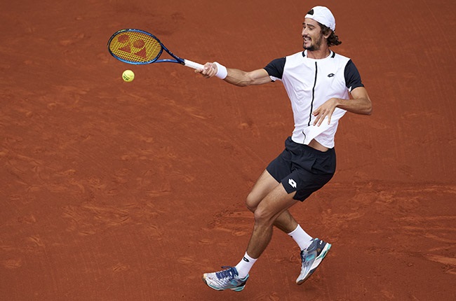 BARCELONA, SPAIN - APRIL 19: Lloyd Harris of South Africa returns a ball to Roberto Carballes of Spain during day two of the Barcelona Open Banc Sabadell at Real Club De Tenis Barcelona on April 19, 2022 in Barcelona, Spain. (Photo by Quality Sport Images/Getty Images)