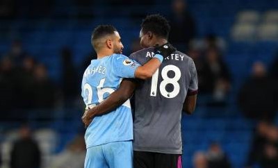 MANCHESTER, ENGLAND - DECEMBER 26: Riyad Mahrez of Manchester City embraces Daniel Amartey of Leicester City after the Premier League match between Manchester City and Leicester City at Etihad Stadium on December 26, 2021 in Manchester, England. (Photo by Matt McNulty - Manchester City/Manchester City FC via Getty Images)