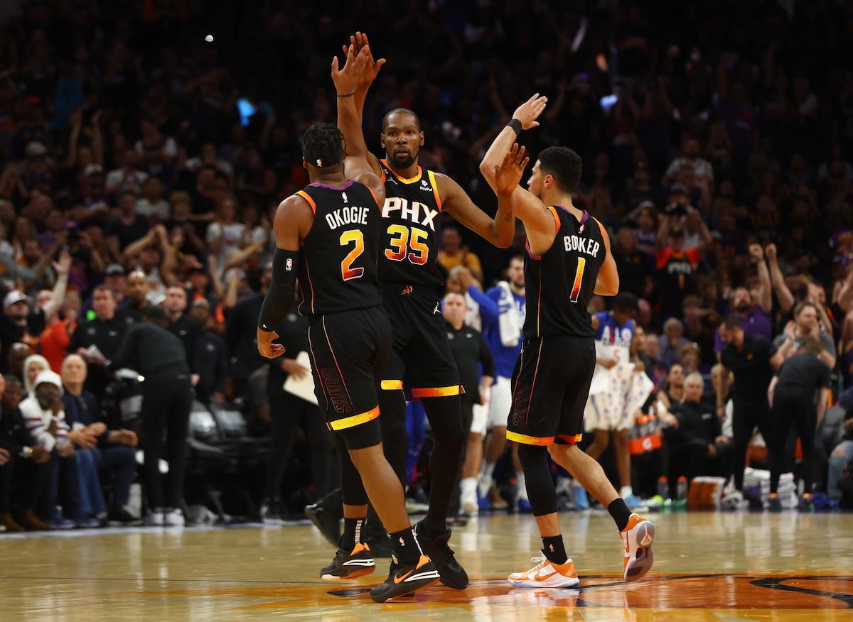 Apr 18, 2023; Phoenix, Arizona, USA; Phoenix Suns forward Kevin Durant (35) celebrates with guard Devin Booker (1) and Josh Okogie (2) against the Los Angeles Clippers in the second half during game two of the 2023 NBA playoffs at Footprint Center. Mandatory Credit: Mark J. Rebilas-USA TODAY Sports