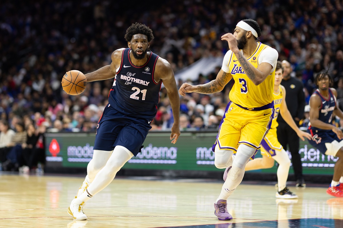 Nov 27, 2023; Philadelphia, Pennsylvania, USA; Philadelphia 76ers center Joel Embiid (21) dribbles the ball against Los Angeles Lakers forward Anthony Davis (3) during the third quarter at Wells Fargo Center. Mandatory Credit: Bill Streicher-USA TODAY Sports