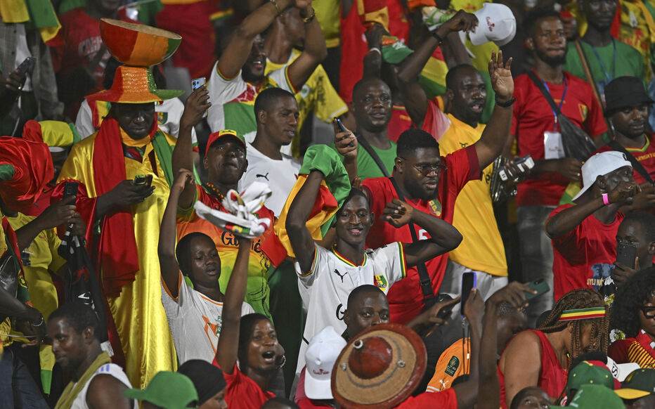 Guiena fans celebrate their win during the 2023 Africa Cup of Nations match between Guinea and Gambia at Charles Konan Banny Stadium in Yamoussoukro, Cote dIvoire on 19 January 2024 - Photo by Icon Sport