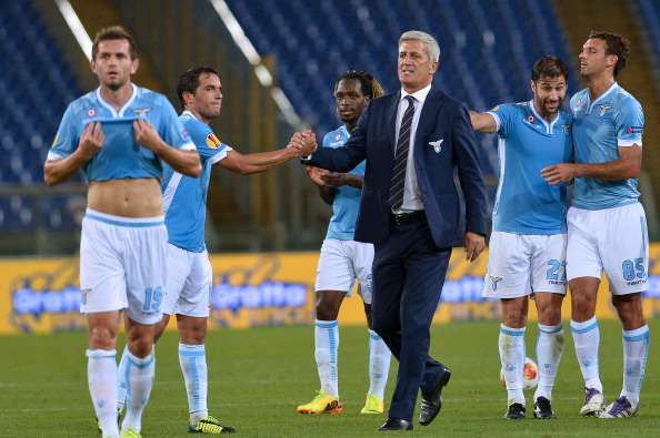 Lazio's Bosnian coach Vladimir Petkovic (C) congratulates his players after the UEFA Europa League match SS Lazio vs Legia Warsaw on September 19, 2013 at the Olympic stadium in Rome. SS Lazio won 1-0. AFP PHOTO / GABRIEL BOUYS        (Photo credit should read GABRIEL BOUYS/AFP/Getty Images)