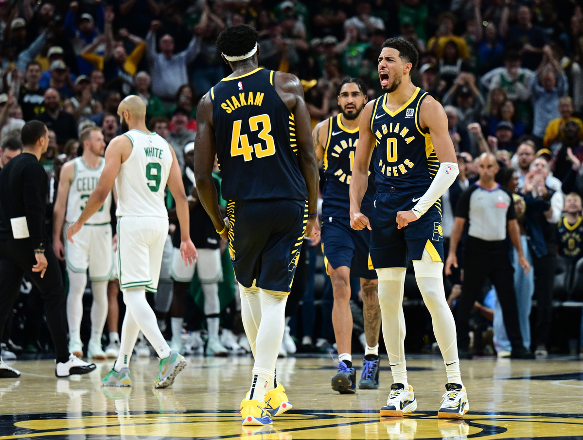 Oct 30, 2024; Indianapolis, Indiana, USA; Indiana Pacers guard Tyrese Haliburton (0) reacts to forward Pascal Siakam (43) making a three point shot to win the game against the Boston Celtics at Gainbridge Fieldhouse. Mandatory Credit: Marc Lebryk-Imagn Images